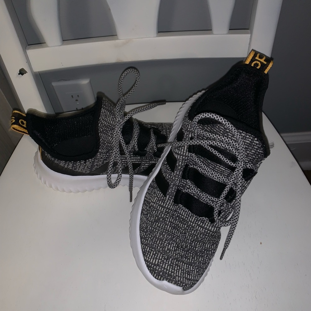Black and white adidas tennis shoes